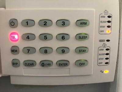 alarm control panel with buttons, some lit up